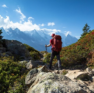 Man with backpack hiking on mountain